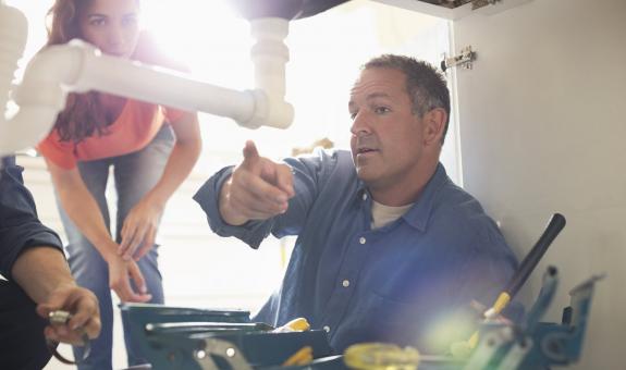 Contractor under sink