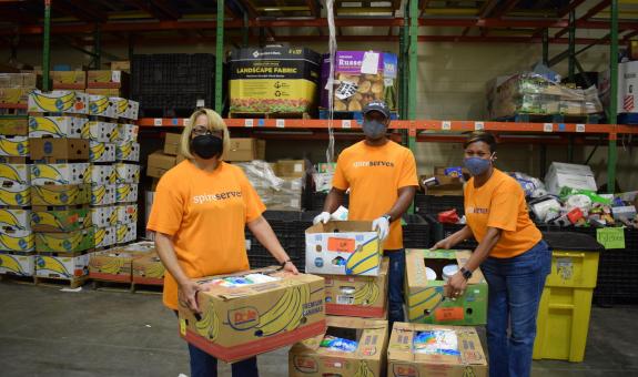 Image of: Spire employees volunteering at food pantry