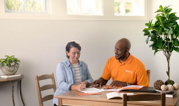 Image of: Spire technician talking to woman