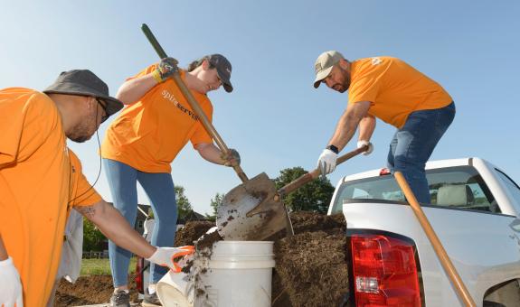 Image of: Spire employees mulching