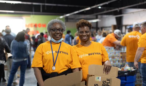 Image of: Spire employees volunteering at local food bank