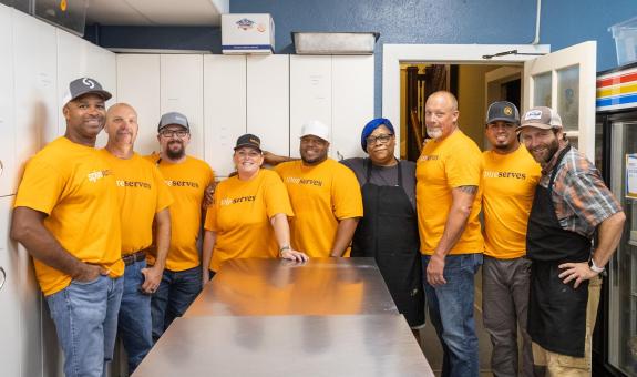 spire volunteers in community kitch