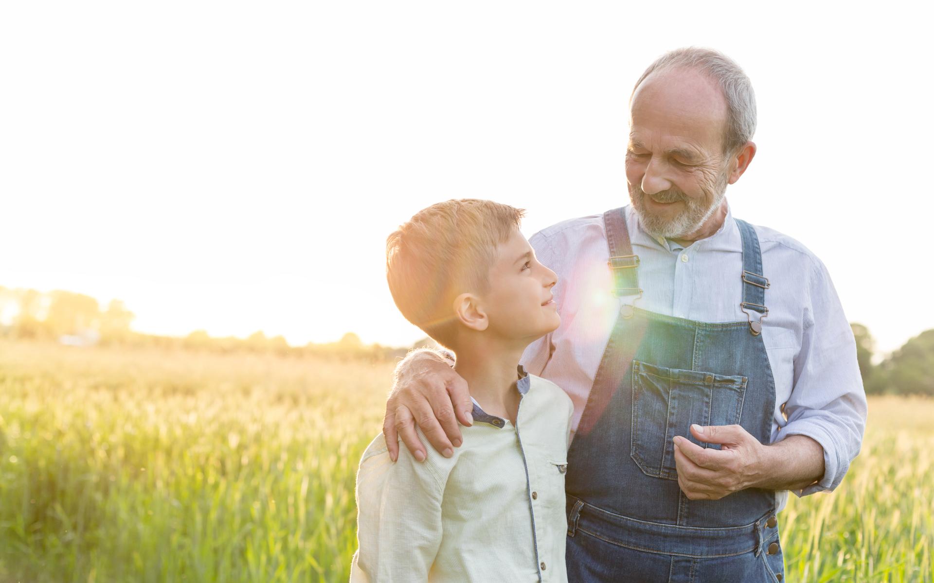 Farmer and son in field