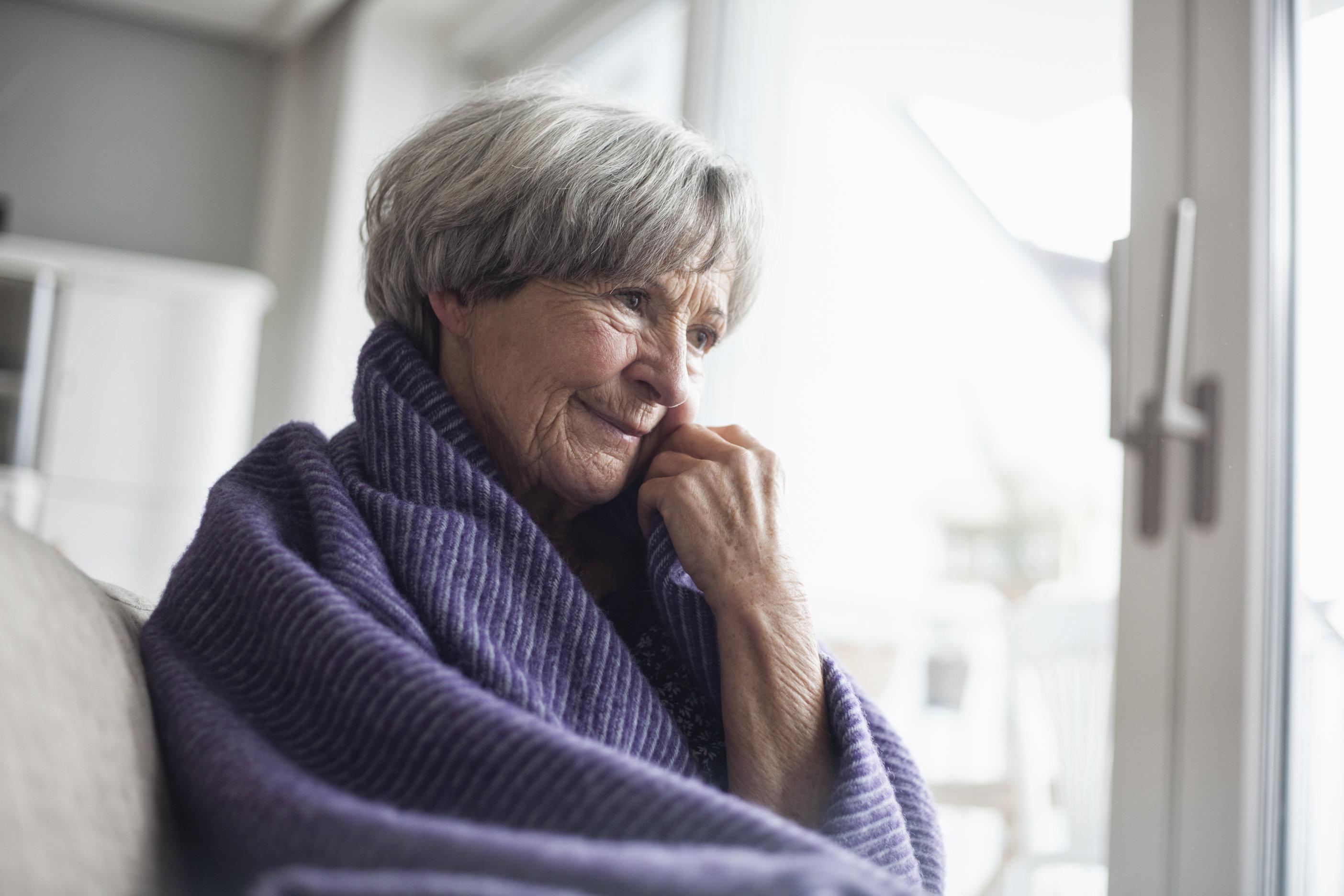 Grandma warming up with blanket