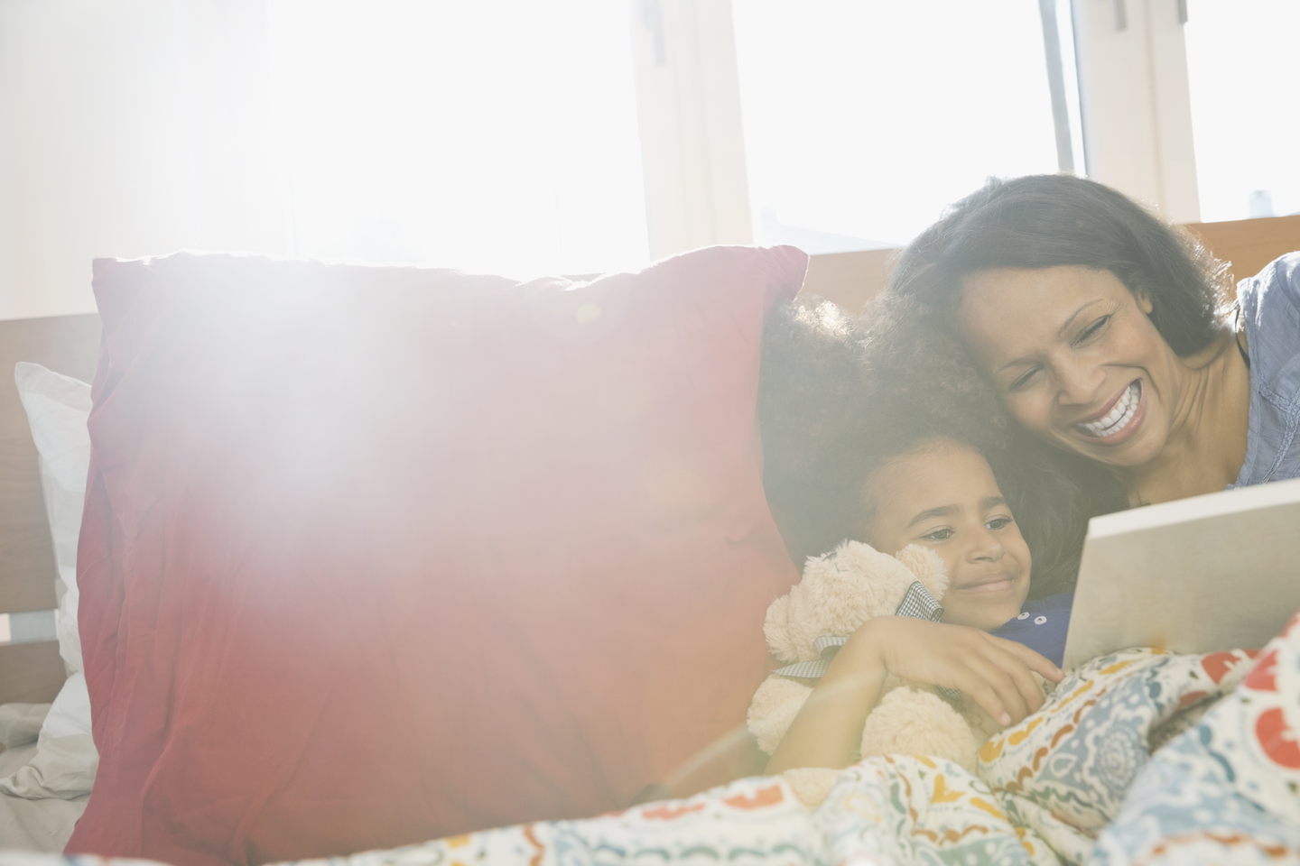 Mother and daughter reading tablet