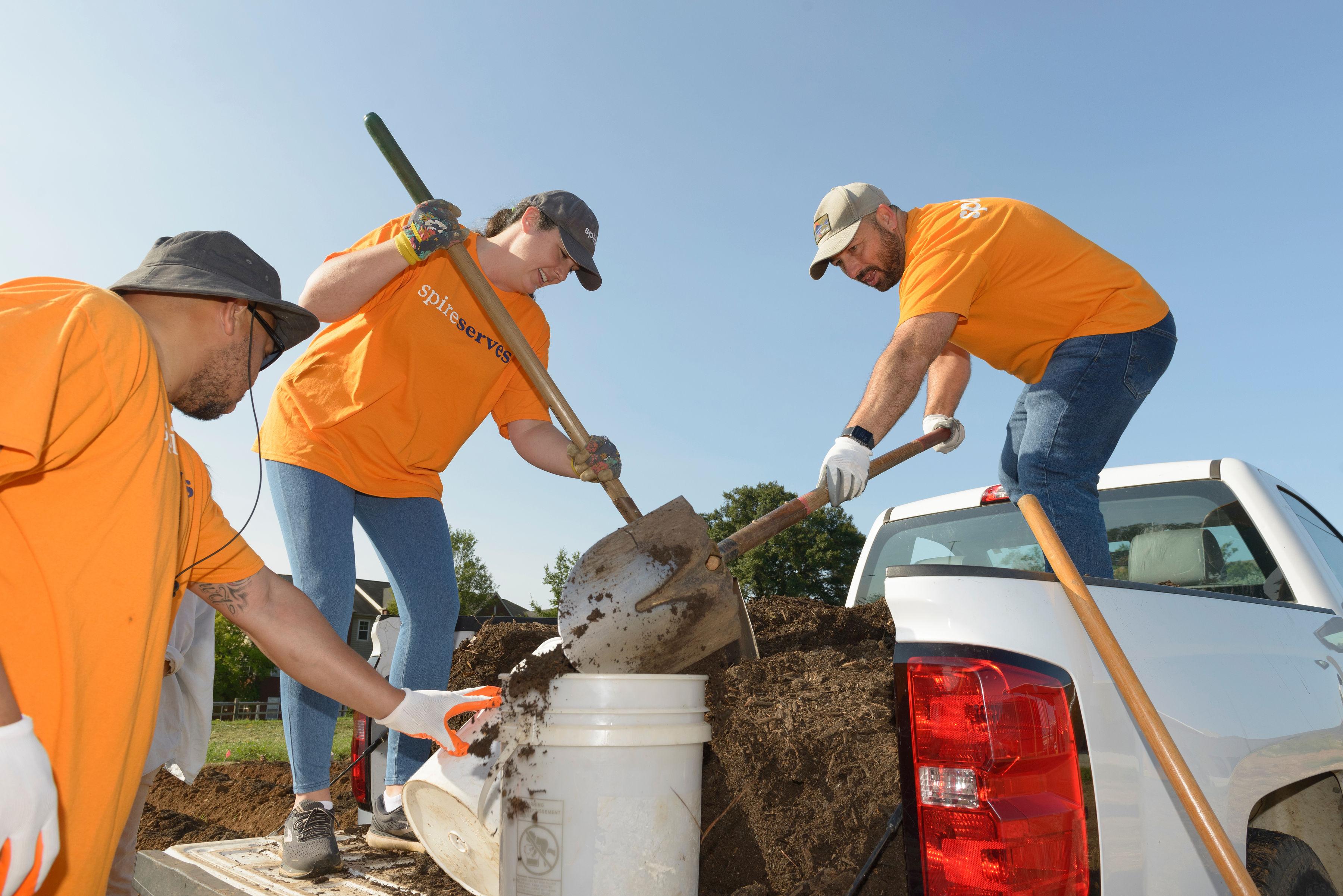 Image of: Spire employees mulching