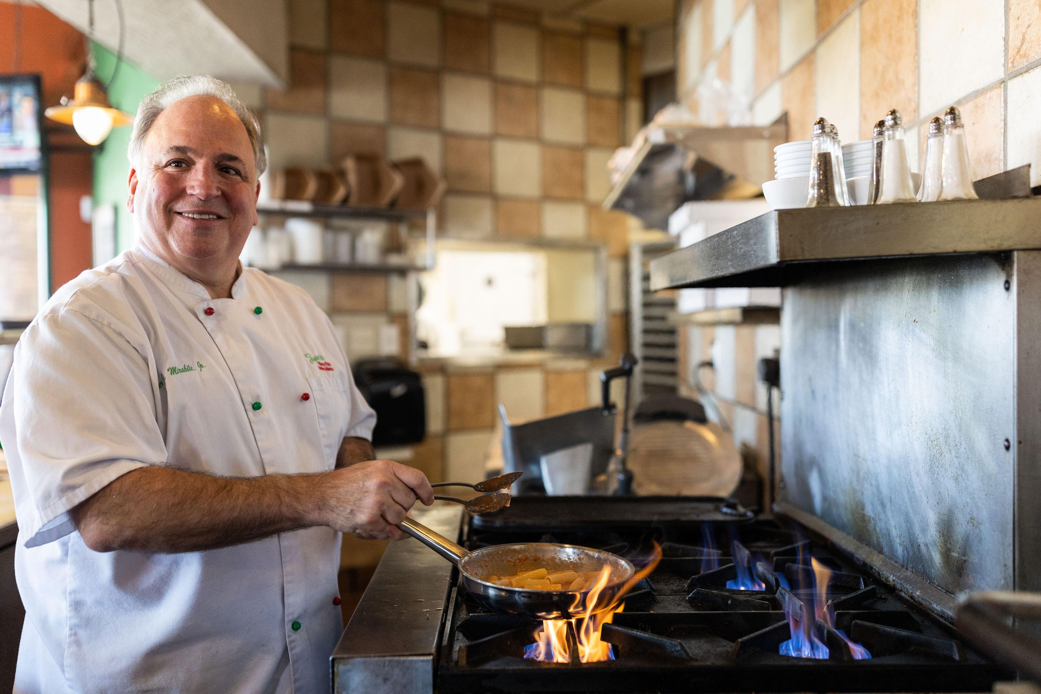 Image of: Chef cooking on natural gas restaurant stove