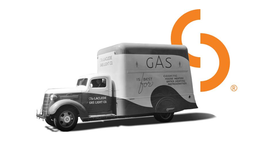Image of vintage Spire truck with Spire logo in the background