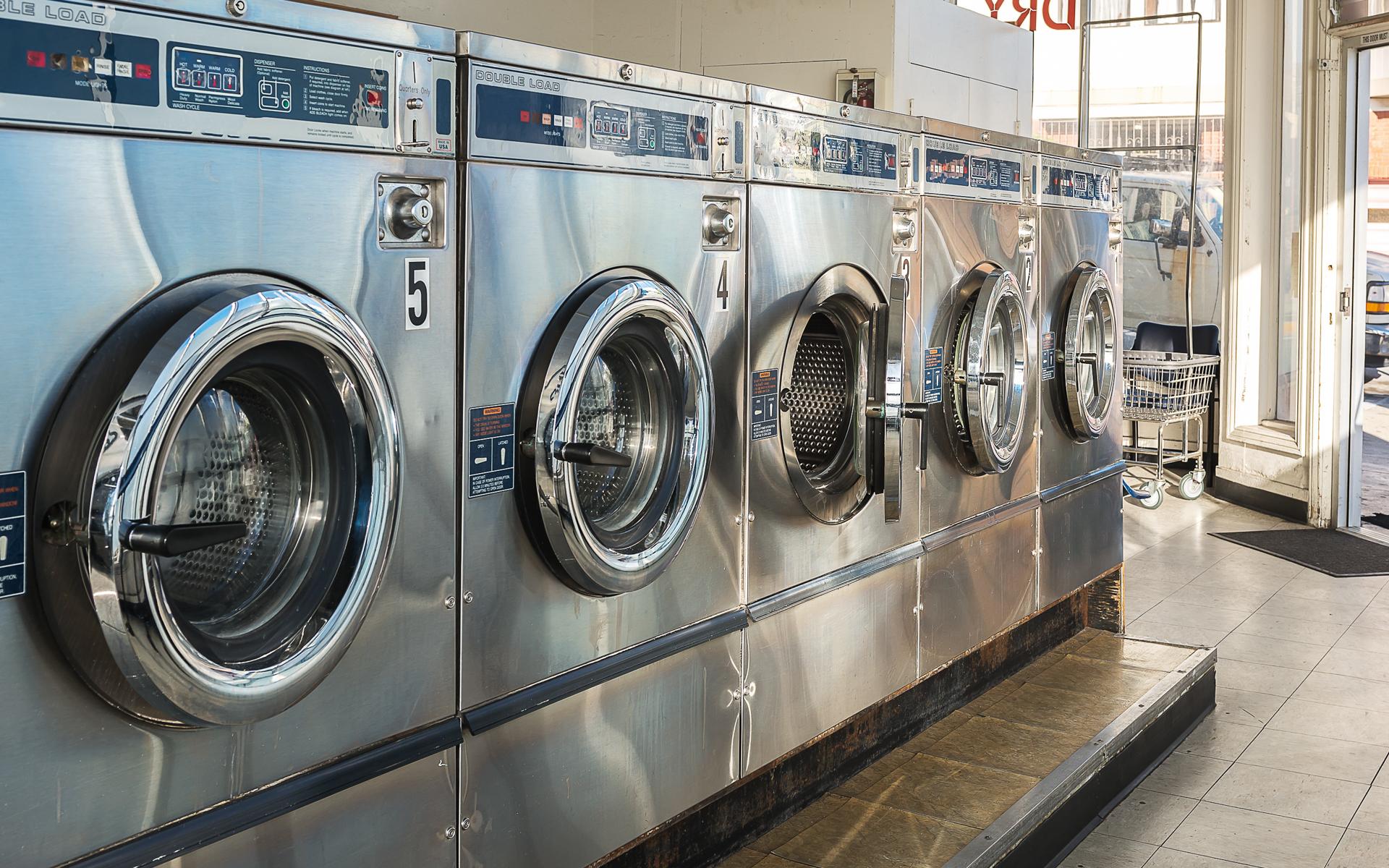 Image of Industrial washing machines in laundromat