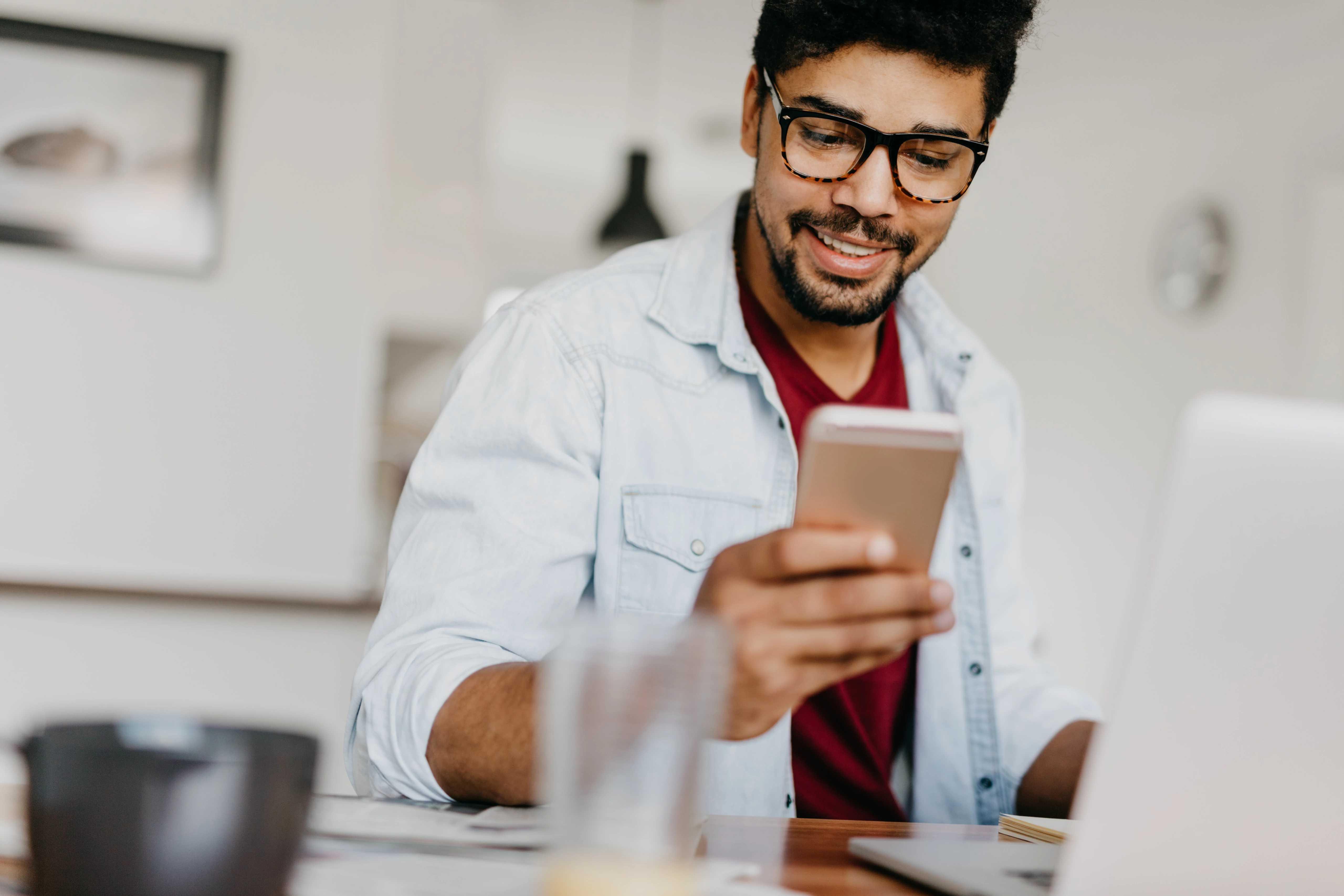 Image of man looking at his phone 