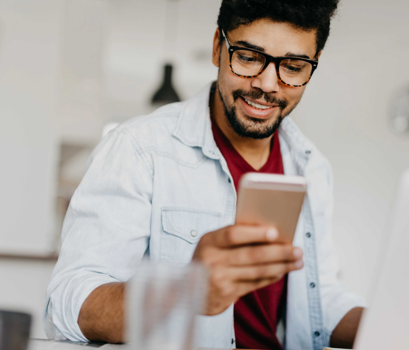 Image of man holding his phone