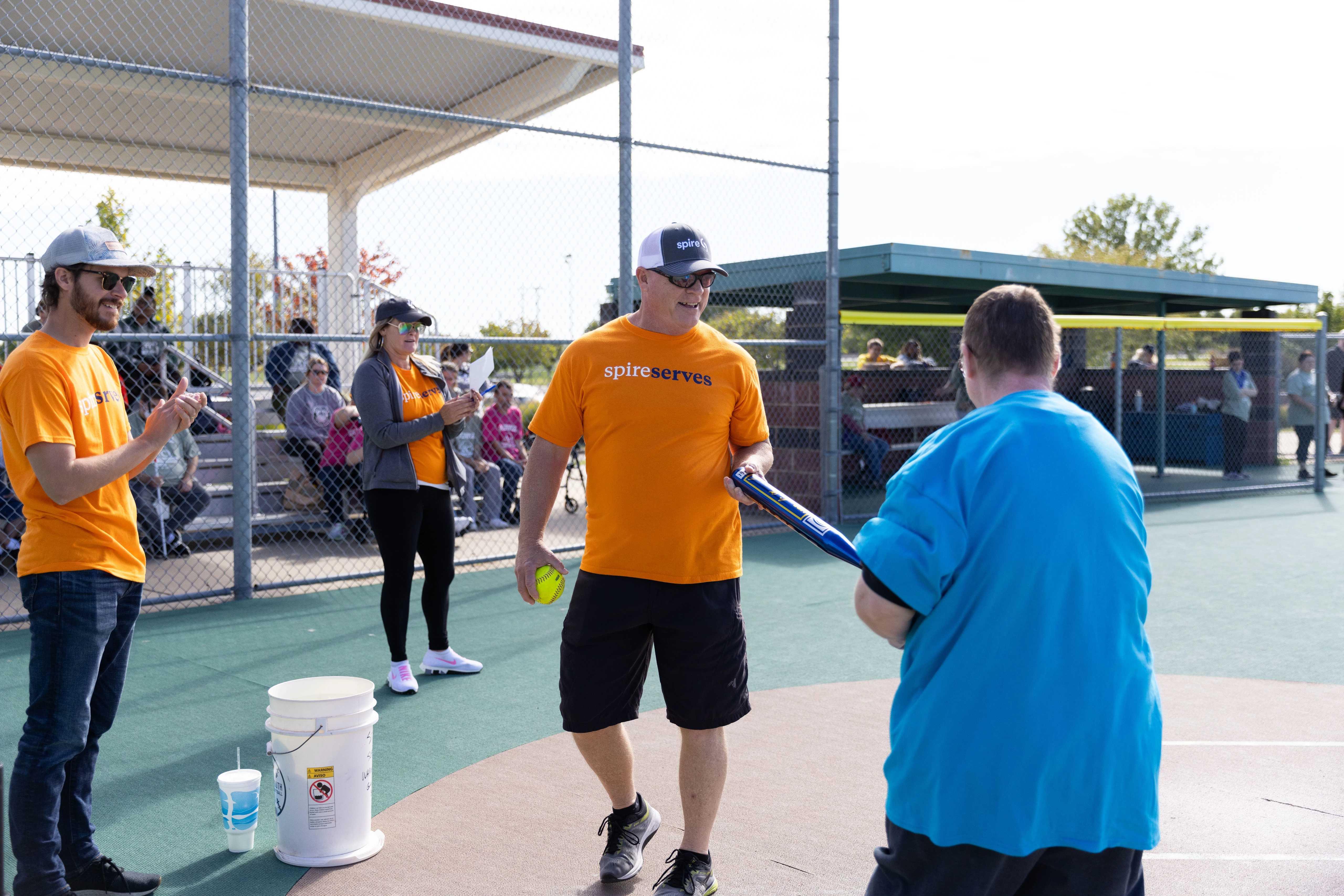 Spire employees volunteering at a softball game