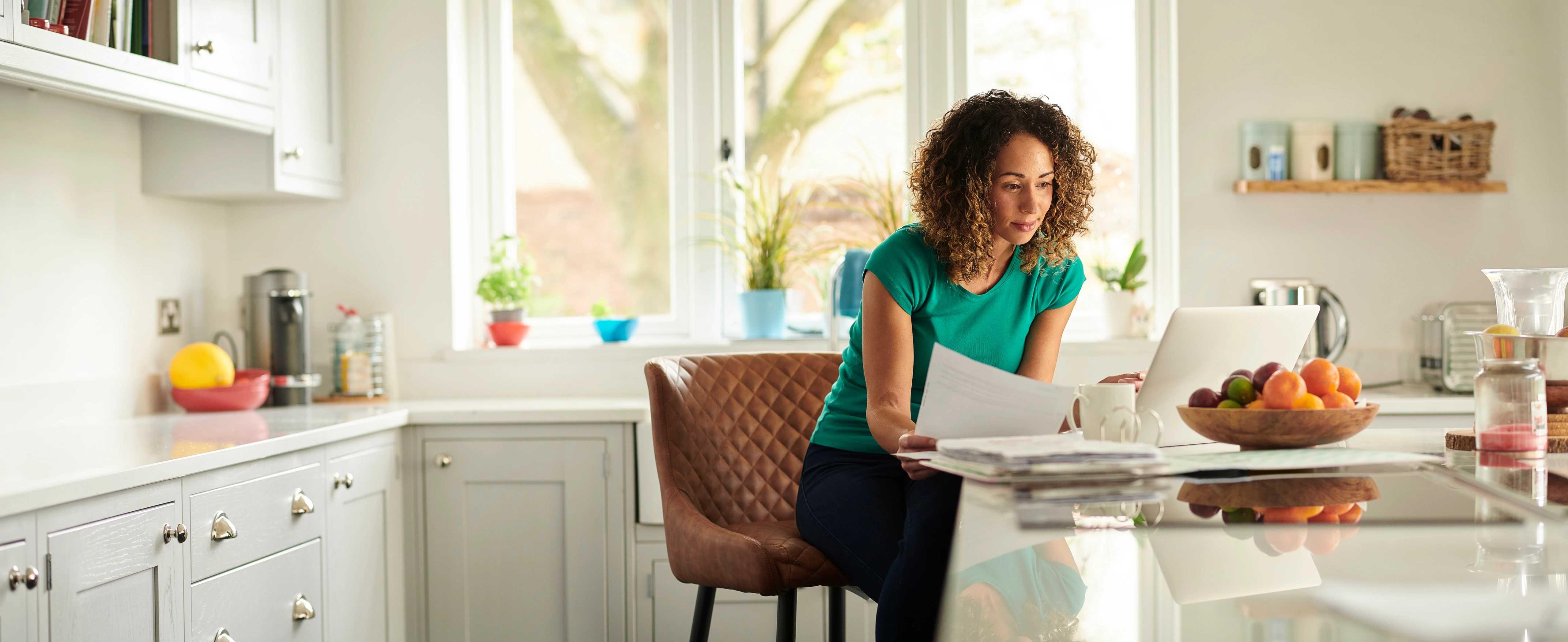 Image of woman looking at computer