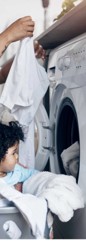 Image of baby by the dryer