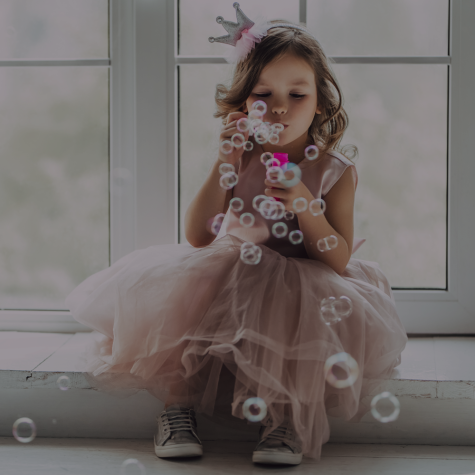 Image of little girl blowing bubbles