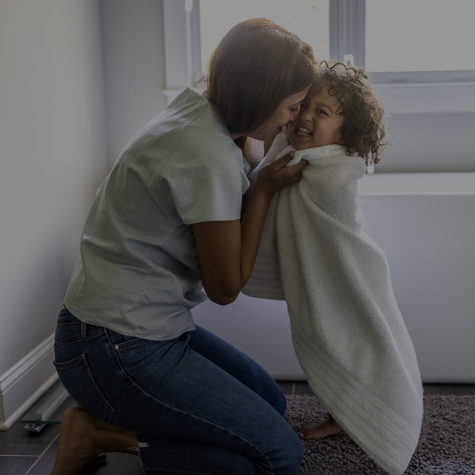 Image of mom and daughter in front of a bathtub